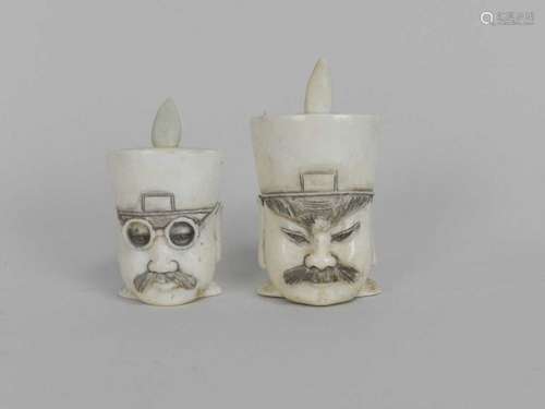 A pair of Japanese carved ivory snuff pots, circa 1900, modelled as the busts of officials, 5.5cm