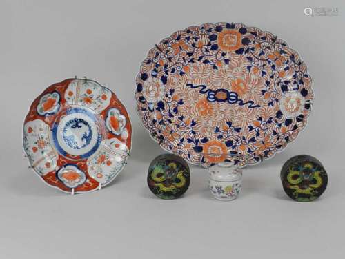 An assembled group of Japanese and Chinese ceramics and enamels, including a lobed oval Imari