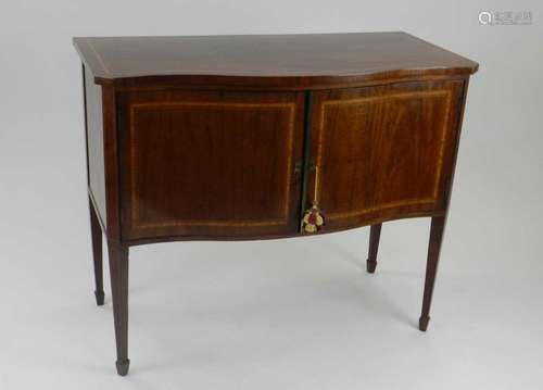 An Edwardian inlaid mahogany serpentine fronted sideboard, Williams of London, the top inlaid with