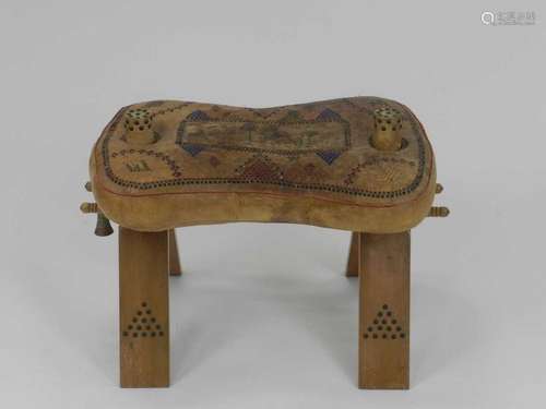 A vintage leather and wood camel saddle, Egyptian or Morrocan, with stitched and printed