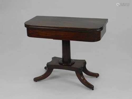 A late Victorian mahogany fold over pedestal tea table, of D form, the revolving top on a plain stem