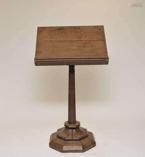 A Victorian heavy ecclesiastical oak lectern, the top with pierced motifs, over a tapering stem