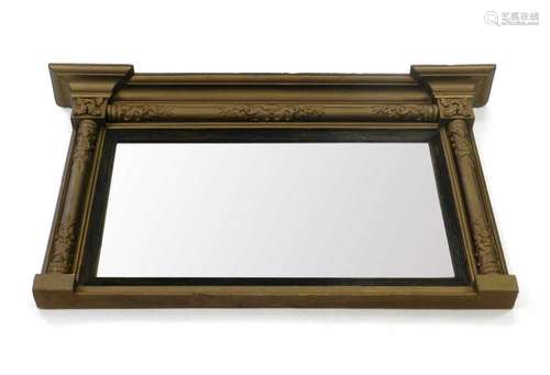 A reproduction giltwood wall mirror, the plain plate within a reeded frame flanked by moulded