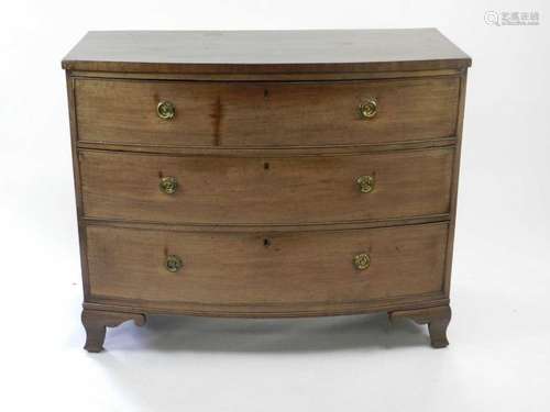 A 19th century mahogany veneered bowfronted chest of three long drawers, some damage and