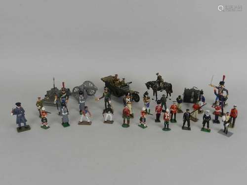 A quantity of mixed lead model soldiers, various makers and including eight artillery pieces,