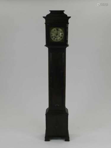 An Edwardian oak 'grandmother' clock, with ogee hood and geometric panelled door, the 9