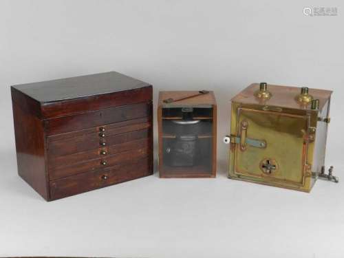 An early/mid 20th century mahogany-cased dental surgery kit, including various implements and