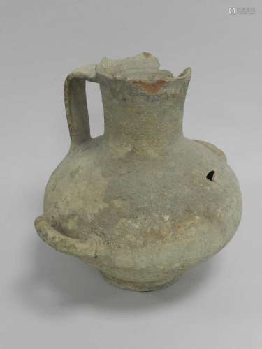 An Egyptian pottery beer or water vessel, New Kingdom (1550-1070 BC), of onion form with broad strap