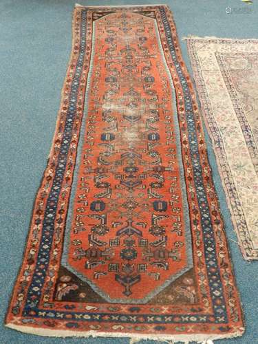 An Anatolian runner, 280cm x 83cm, together with a Central Persian rug, 190cm x 128cm (heavily