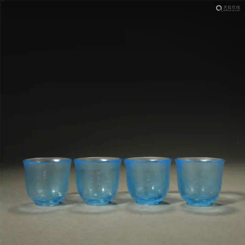 A GROUP OF BLUE GLASS CUPS