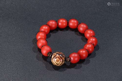 A Red Agate Bracelet With Dzi