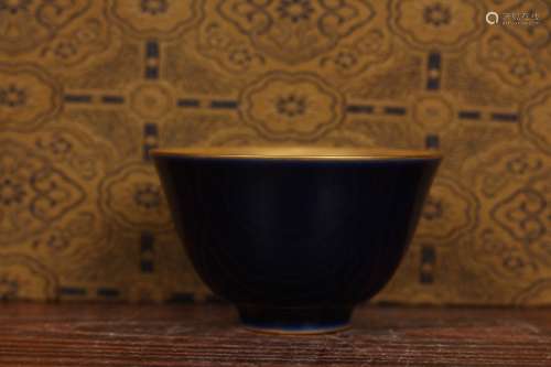 A Porcelain Cup With Gold Painting