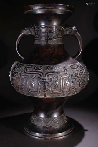 A Bronze Vase With Beast Carving