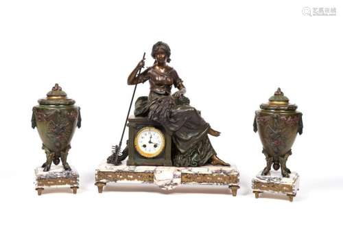 D'après MOREAU. Garniture de cheminée en régule patiné et marbre veiné blanc et rose, comprenant une pendule et deux vases couverts. La pendule à décor allégorique de l'Agriculture, les vases à décor de trophées agrestes. Signée (Dim pendule : 52 x 49 x 16,5 x cm, H. vases : 35 cm)