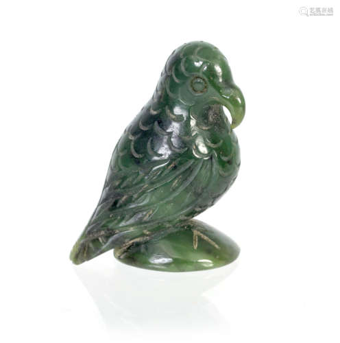 A SPINACH GREEN CARVED JADE FIGURE OF A BIRD 5.5cm high