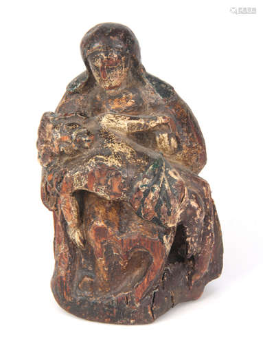 A SMALL LATE 15TH CENTURY CARVED PINE POLYCHROME STATUE 15cm high.