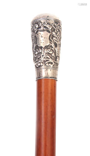 A 19TH CENTURY MALACCA AND SILVER MOUNTED WALKING STICK decorated with dragon and floral work pommel