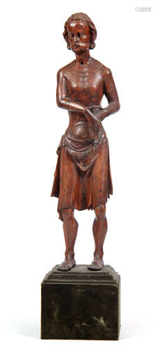 A 14TH / 15TH CENTURY CARVED OAK STATUE OF ST. SEBASTIAN mounted on a velvet-covered square base