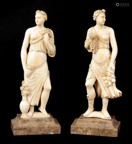 A PAIR OF LATE 19TH CENTURY NEO-CLASSICAL CARVED IVORY STATUES mounted on grey marble moulded