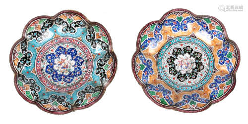 TWO 19TH CENTURY ISNIC ENAMELED DISHES having scalloped edges with birds, flowers, and geometric