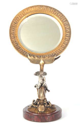 A LATE 19TH CENTURY FRENCH GILT BRONZE DRESSING TABLE MIRROR with circular moulded edge frame
