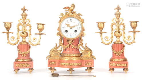 A LATE 19TH CENTURY FRENCH MARBLE AND ORMOLU GARNITURE MANTEL CLOCK the case surmounted by a