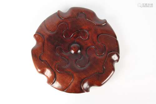 A 19TH CENTURY CHINESE HARDWOOD JARDINIERE/ CENSER STAND carved as a Lotus leaf; standing on small