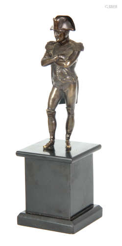 A LATE 19TH CENTURY BRONZE FIGURE OF NAPOLEON standing on a square black slate base 33cm high.