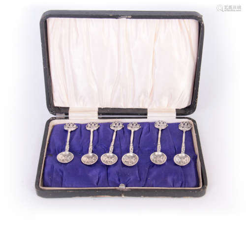 A SET OF SIX EDWARD VII GOTHIC STYLE CAST SILVER COFFEE SPOONS with Galleon topped figural stems and