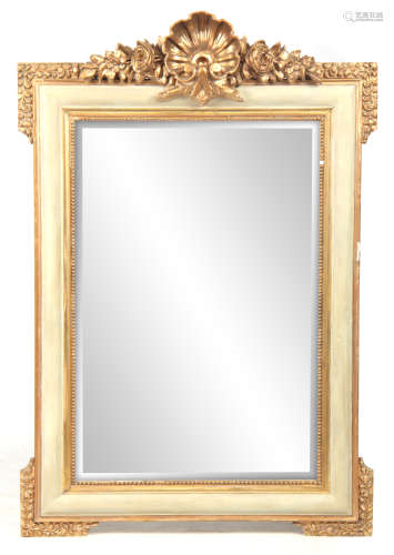 A 20TH CENTURY FRENCH GILT GESSO AND PAINTED HANGING MIRROR with moulded frame and crested floral