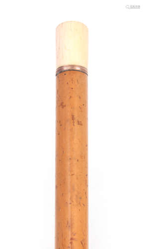 AN 18TH CENTURY IVORY AND MALACCA WALKING STICK with large brass ferrule and ivory pommel with