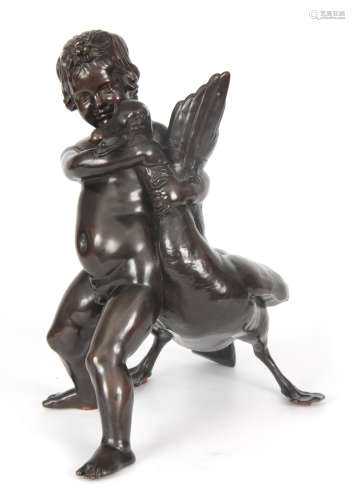 A LATE 19TH CENTURY PATINATED BRONZE SCULPTURE OF A CHERUB AND GOOSE 33cm high 34cm wide.