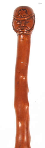 A 19TH CENTURY FOLK ART CARVED HAWTHORN WALKING STICK depicitig a soldier 92cm overall.