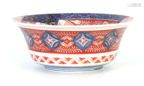AN IMARI DEEP FOOTED BOWL WITH EVERTED RIM with detailed polychrome decoration in blues, green and