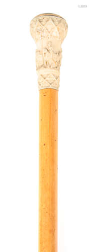 AN EARLY 19TH CENTURY MALACCA CANE WALKING STICK WITH FINELY CARVED IVORY HANDLE AND CARVED MOTHER