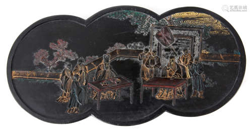 A 19TH CENTURY CARVED EBONY CHINESE INK BLOCK decorated with figures in a village setting and