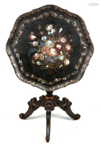 A 19TH CENTURY PAPIER MACHE TILT TOP OCCASIONAL TABLE with a scalloped edge top decorated with