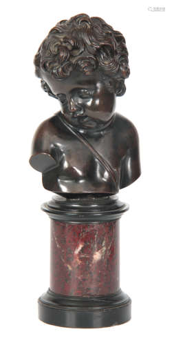 A 19TH CENTURY FRENCH BRONZE BUST OF A CHERUB mounted on a rouge marble and black slate turned socle