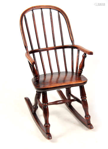 AN EARLY 19TH CENTURY ASH AND ELM CHILD'S CHAIR with hooped back, saddle seat and turned legs