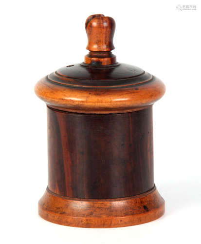 A 19TH CENTURY LIGNUM VITAE STRING BOX of turned cylindrical form with incised lid and raised knop