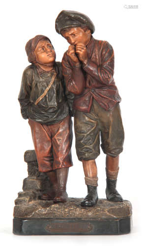 A 19TH CENTURY AUSTRIAN PAINTED TERRACOTTA FIGURE GROUP modeled as two standing boys labeled DU