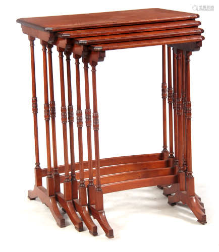 A NEST OF FOUR EARLY 20TH CENTURY SATINWOOD AND MAHOGANY INLAID OCCASIONAL TABLES the rectangular