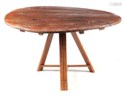 AN EARLY 19TH CENTURY CONTINENTAL PINE FARMHOUSE TABLE with circular top above a tripod base