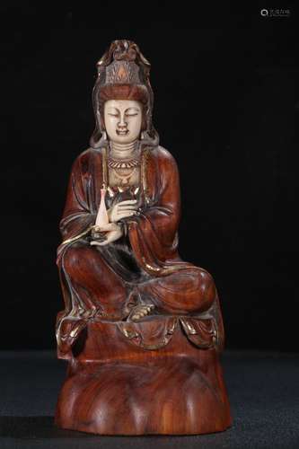 A Yellow Pear Wood Guanyin Ornament