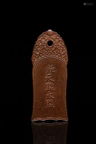 An Agarwood Pendant With Carving