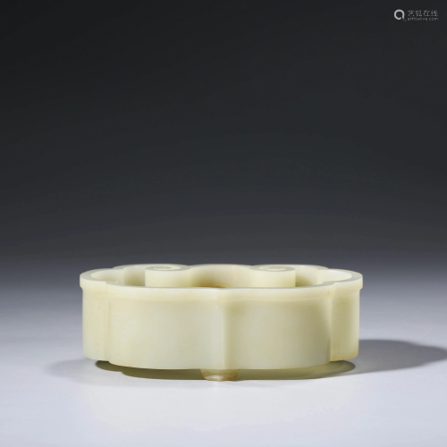 A CHINESE WHITE JADE FLORIFORM WASHER