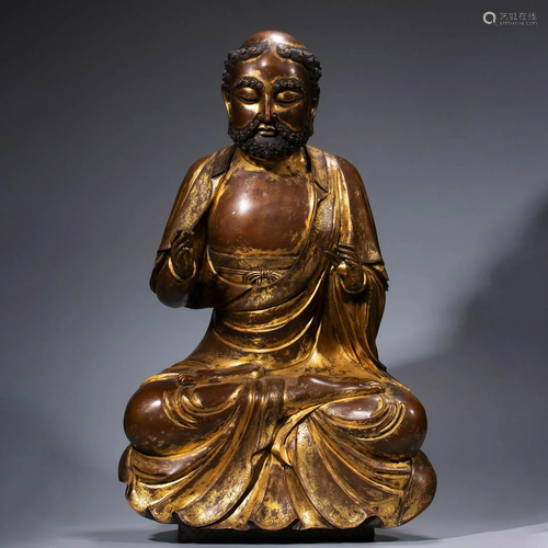 A CHINESE GILT-BRONZE ARHAT STATUE