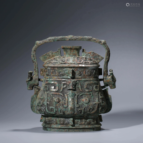A CHINESE BRONZE WINE VESSEL WITH COVER