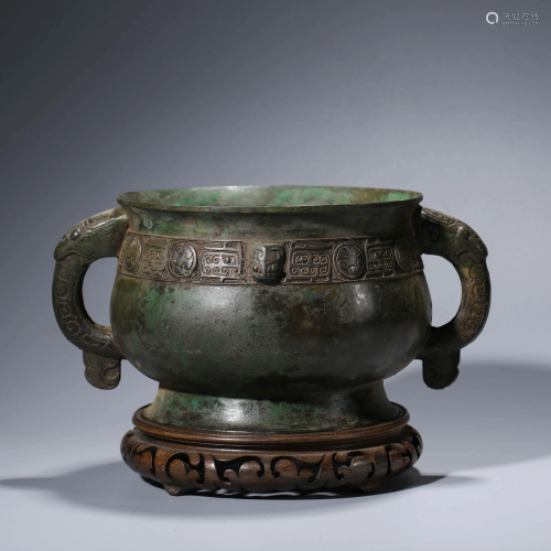 A CHINESE BRONZE STEAMING VESSEL WITH WOOD ST…