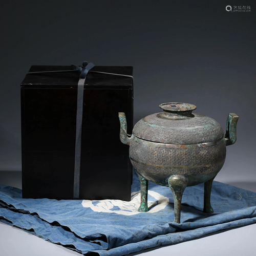 A CHINESE BRONZE STEAMING VESSEL